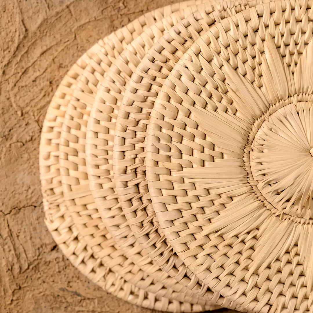 Round chabbi mats woven from split date-palm leaf