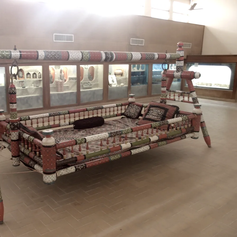 A lacquered Sindhi wooden swing in the Sindh Museum