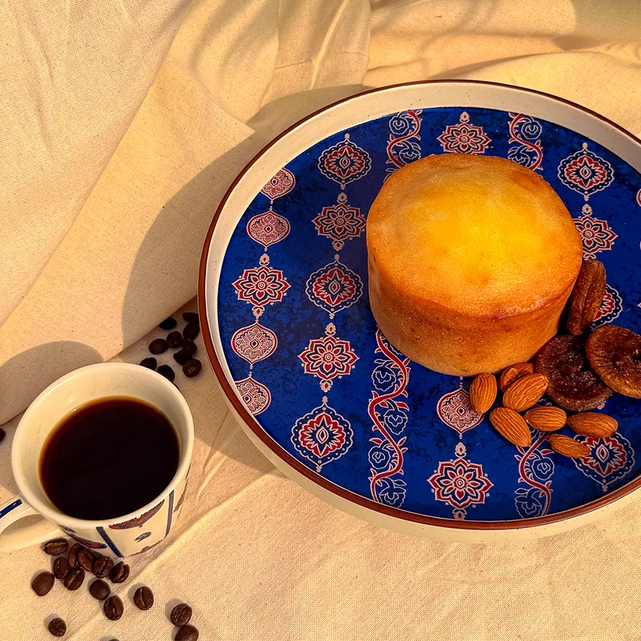 Cake and coffee on a patterned plate