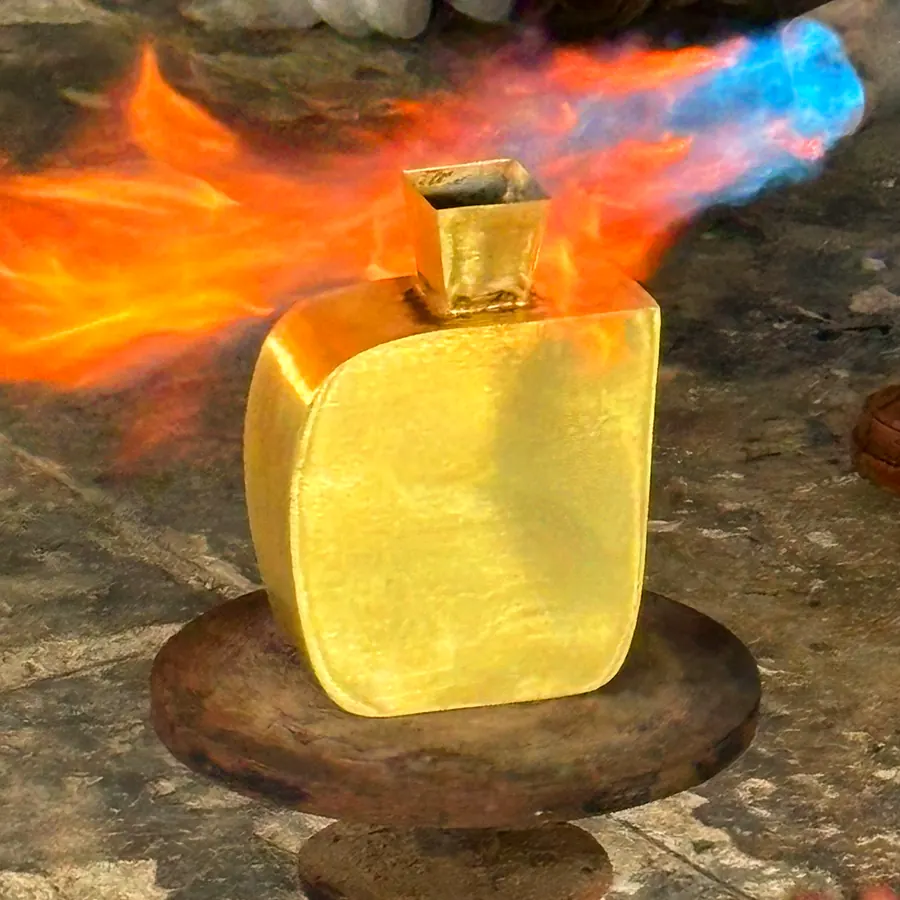 An iron vessel standing in the flame of a torch at the workshop